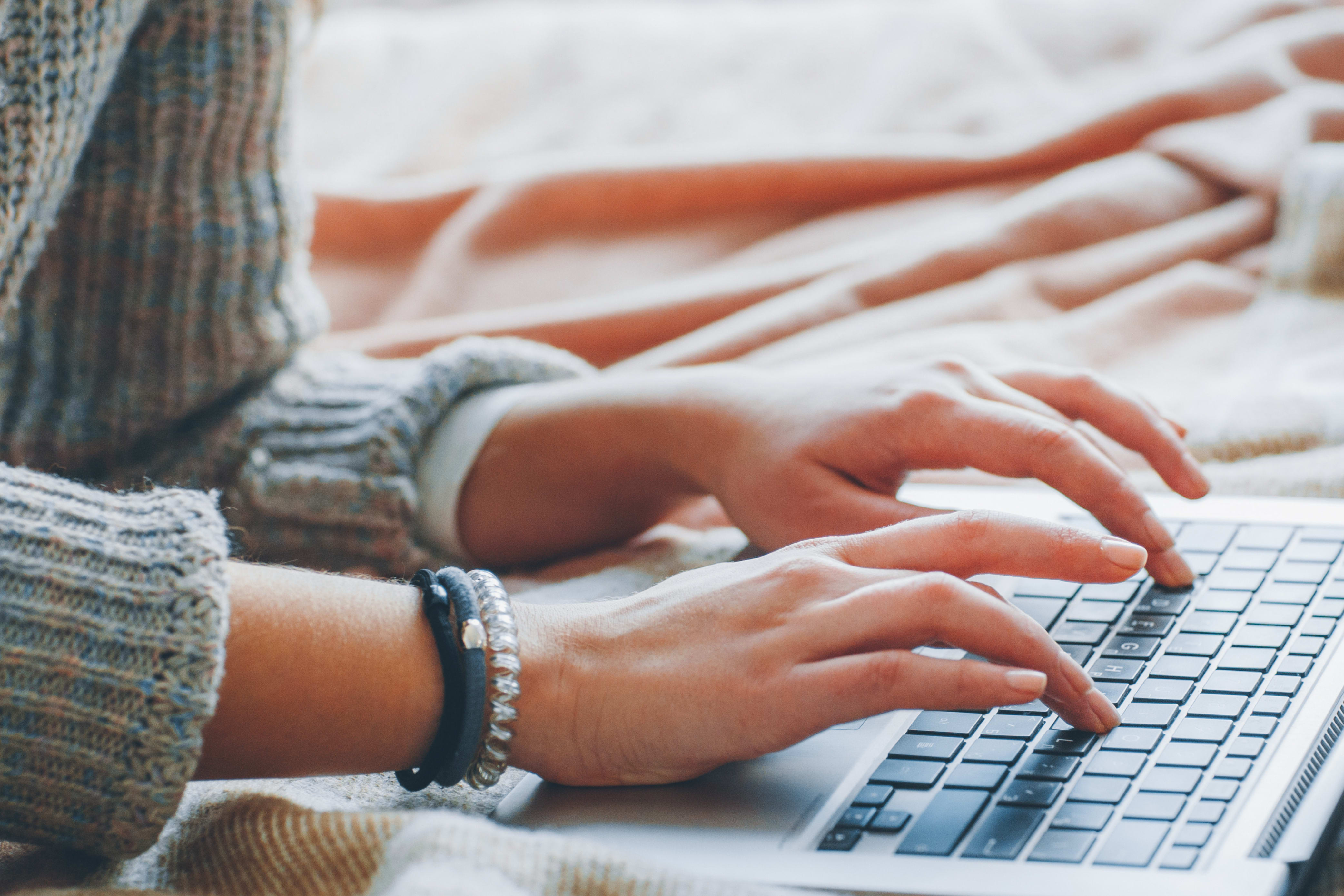 technical writer typing on a keyboard
