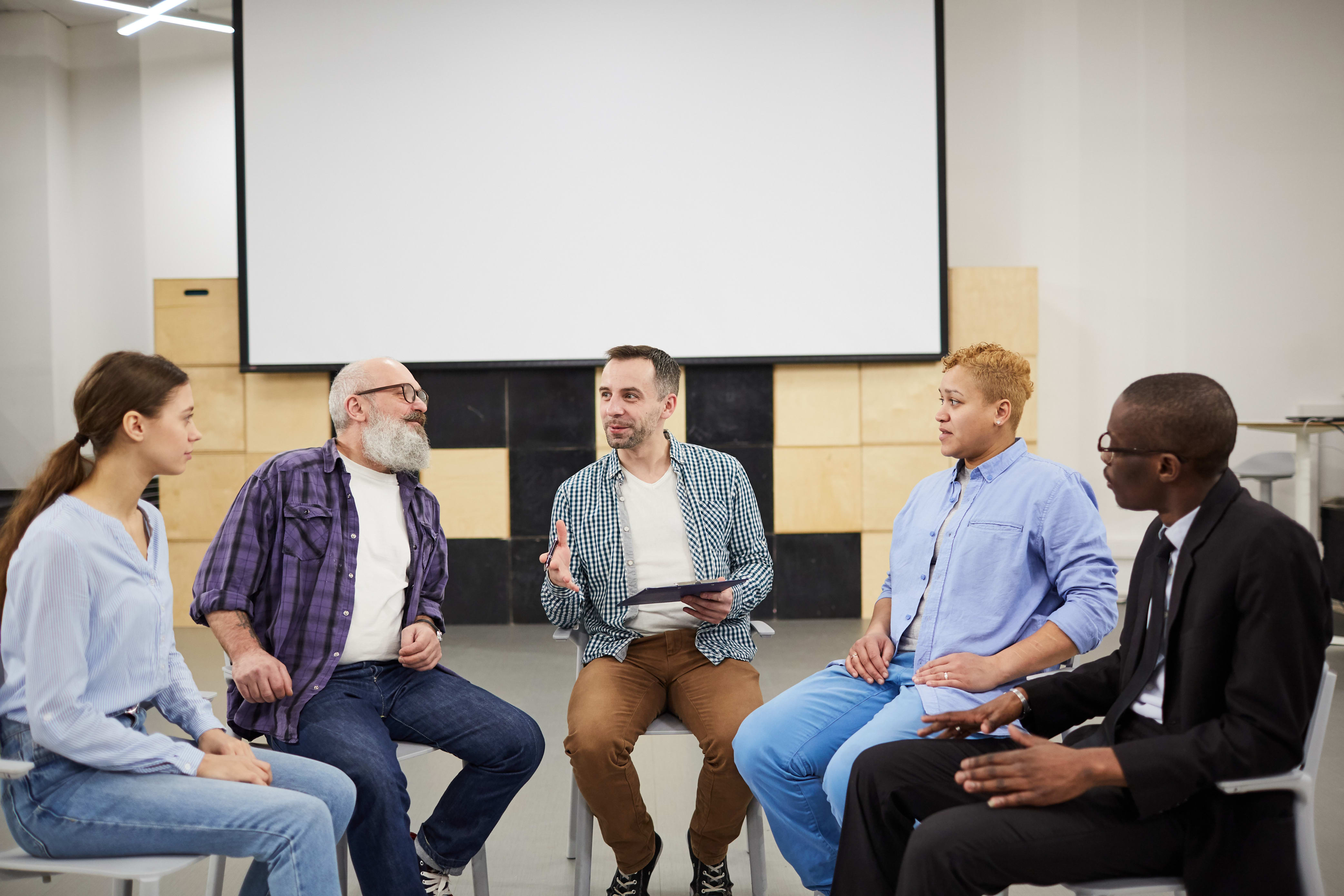 substance abuse counselor conducting a group meeting