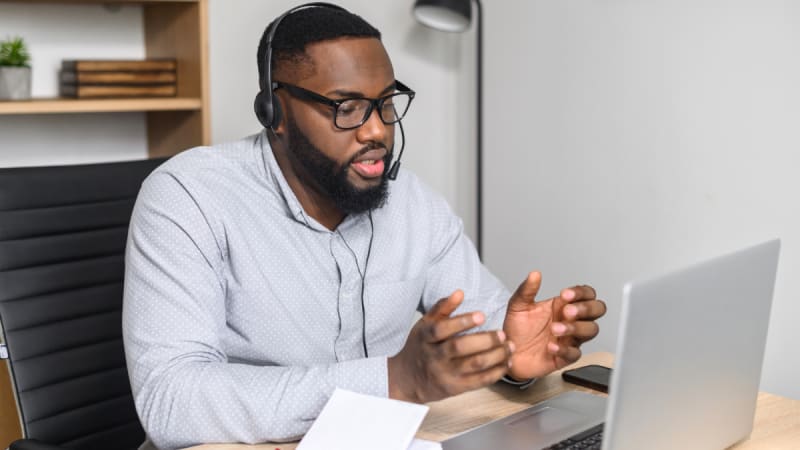 Man with glasses talking on a video call