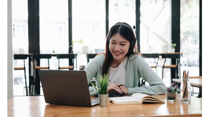 Woman working at a desk on a laptop