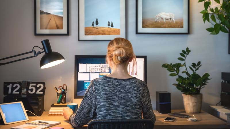 Woman working at a desk on a computer