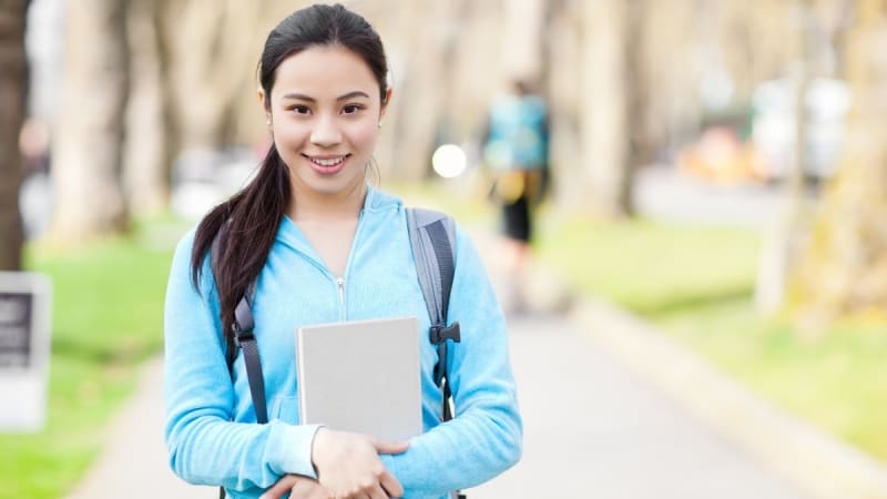 Female student outside on a college campus