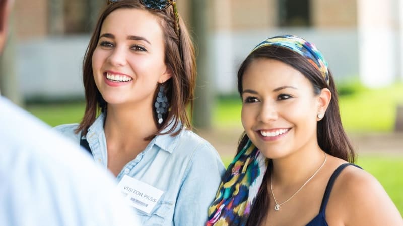 Two women smiling