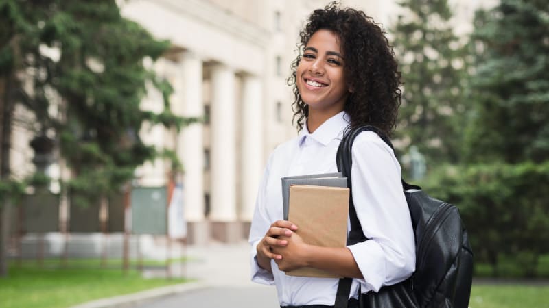 Woman standing on a college campus