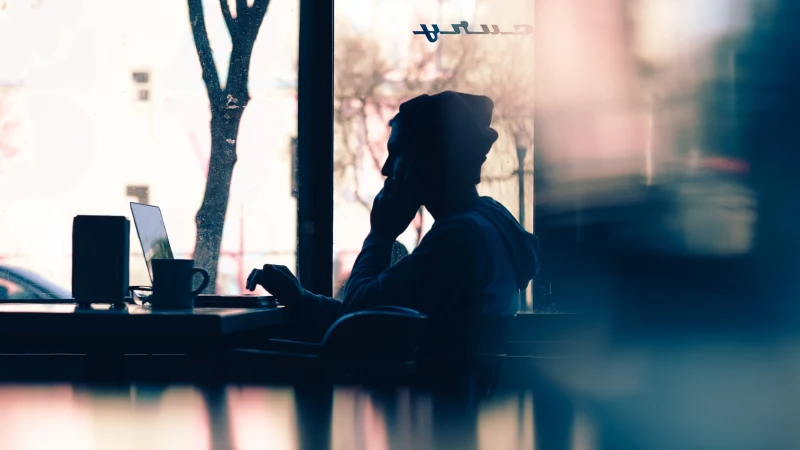 Student studying next to a window