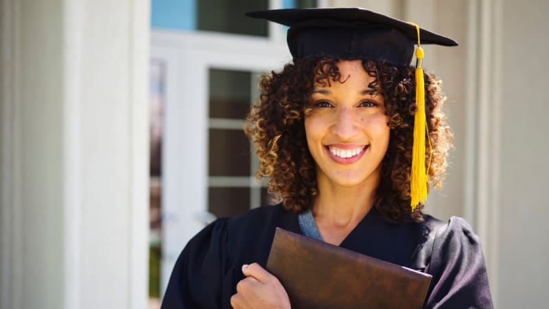 Woman in graduation cap and gown