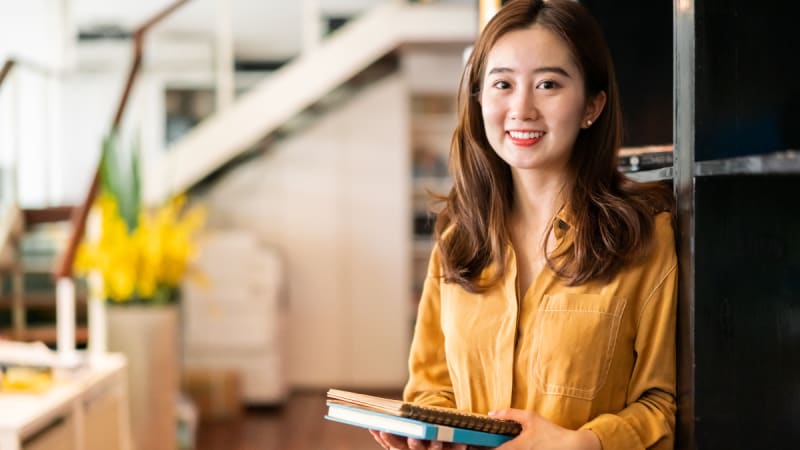 Woman smiling at a desk