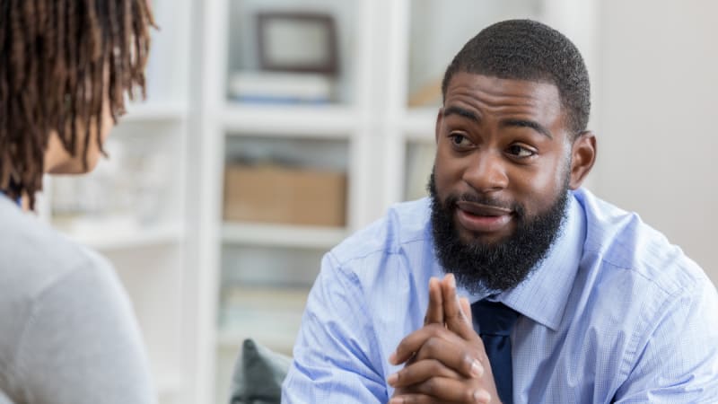 Man talking to a woman