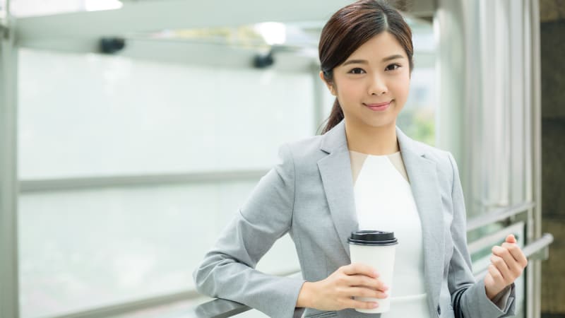 Woman holding a coffee