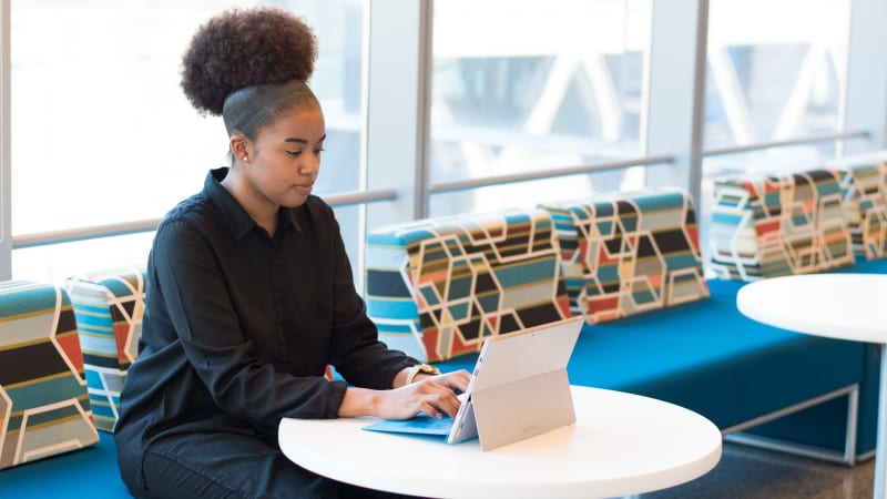 Woman doing math on her laptop